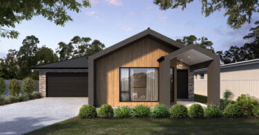 Modern single-story house with wood cladding, brick accents, large front window, and a covered entry amid landscaped greenery.